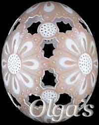 Etched and carved brown chicken egg.
